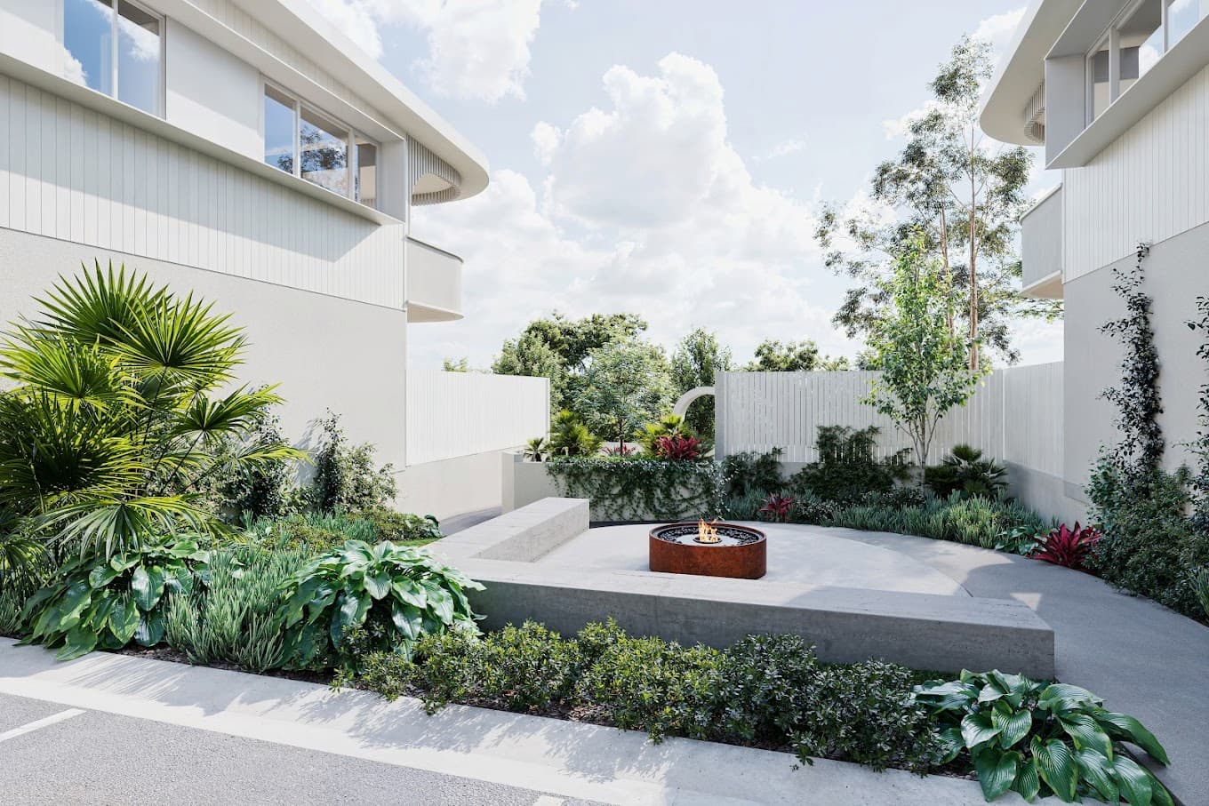 modern white home with greenery and fire pit