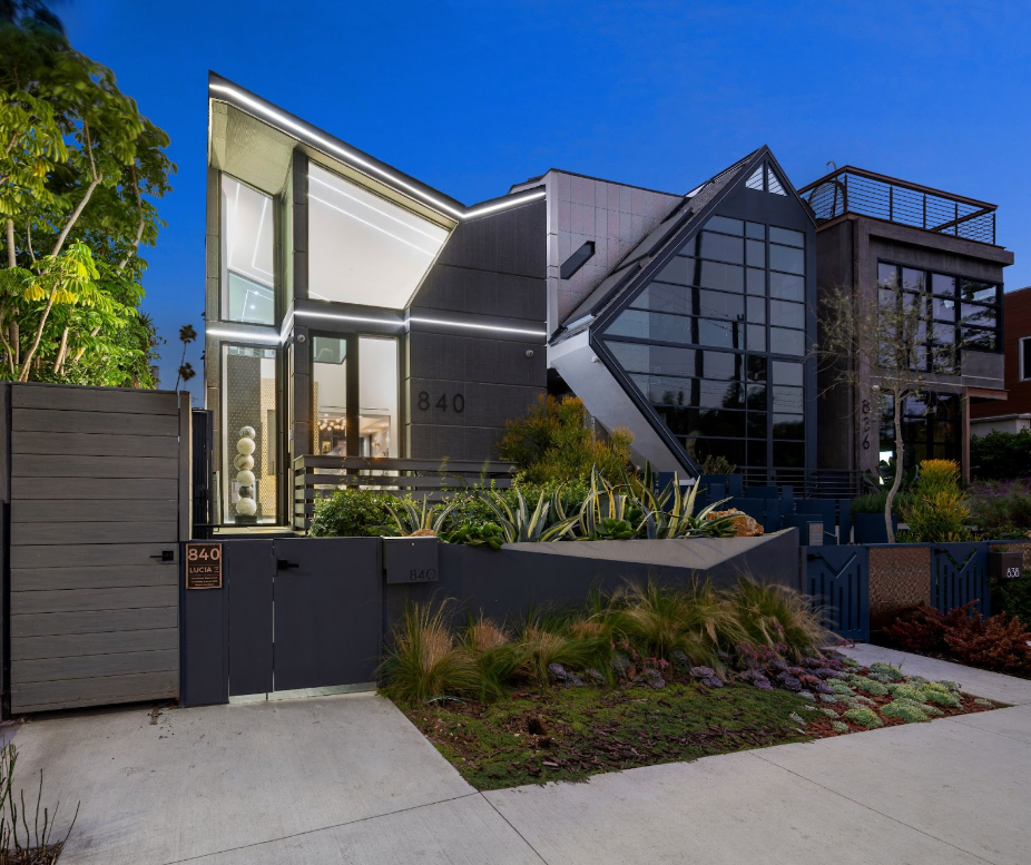 hyper-modern home with butterfly roof type style